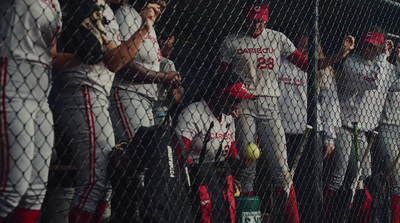 a group of baseball players standing next to each other