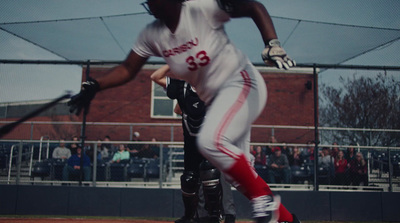 a baseball player holding a bat on top of a field