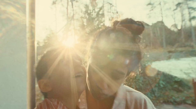 a man and a woman are looking into the camera