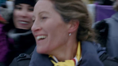 a close up of a person wearing a jacket and smiling