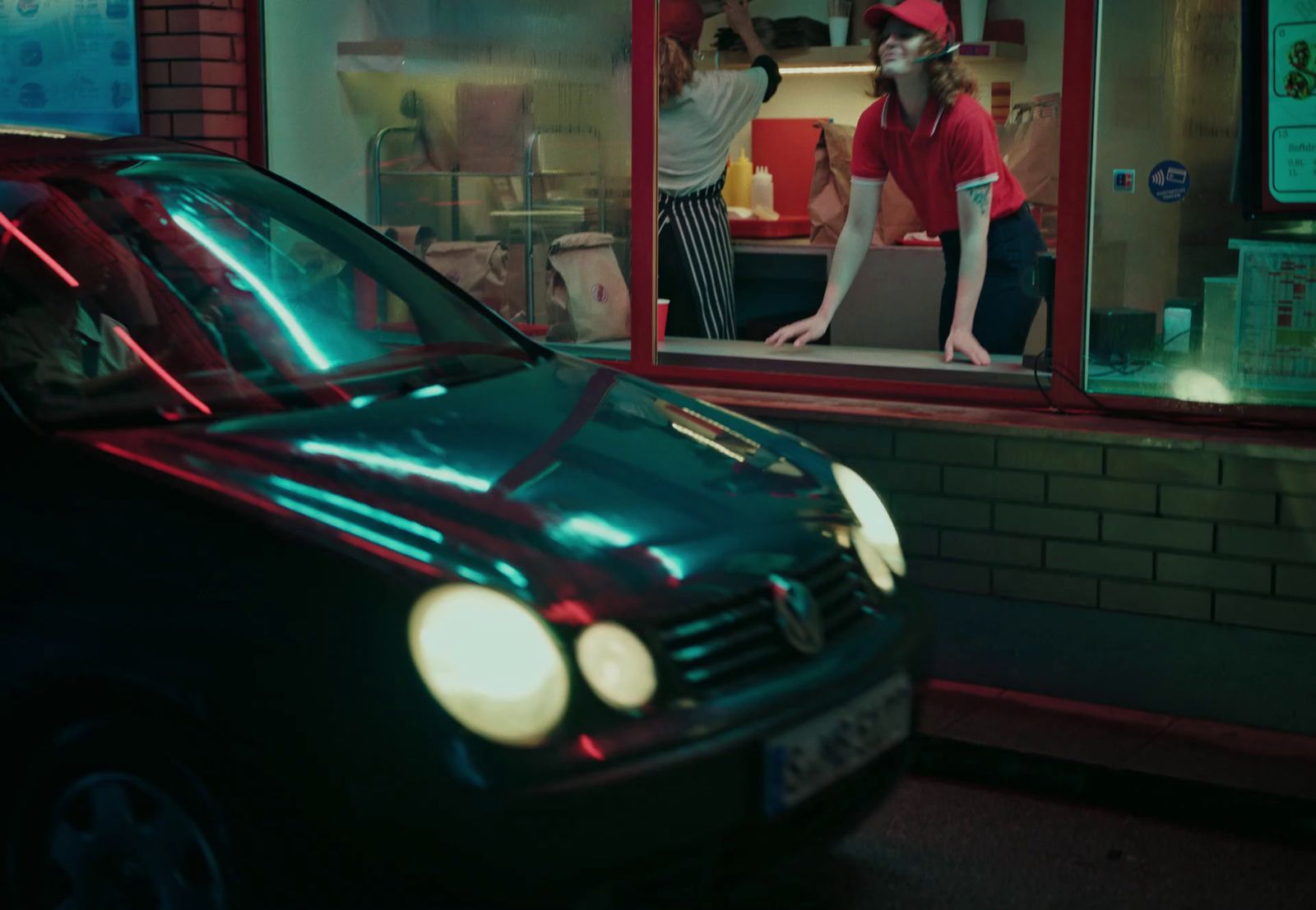 a car is parked in front of a restaurant