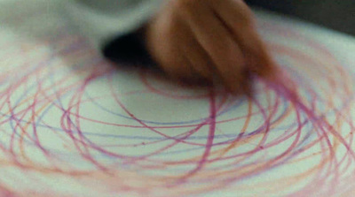 a close up of a person's hand on a white plate