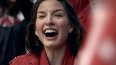 a woman with her mouth open in a stadium