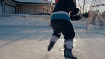 a person is skating on an ice rink