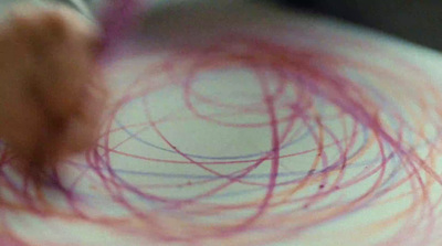 a close up of a person's eye with a needle in it