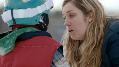 a woman in a red jacket and a man in a blue jacket