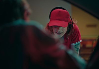 a woman wearing a red hat and a red shirt