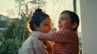 a boy and a girl standing next to each other