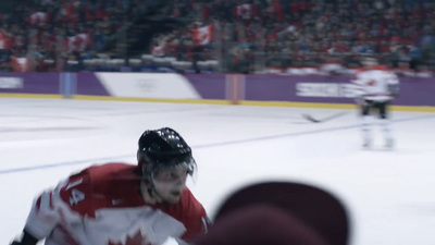 a hockey player in a red and white uniform on the ice