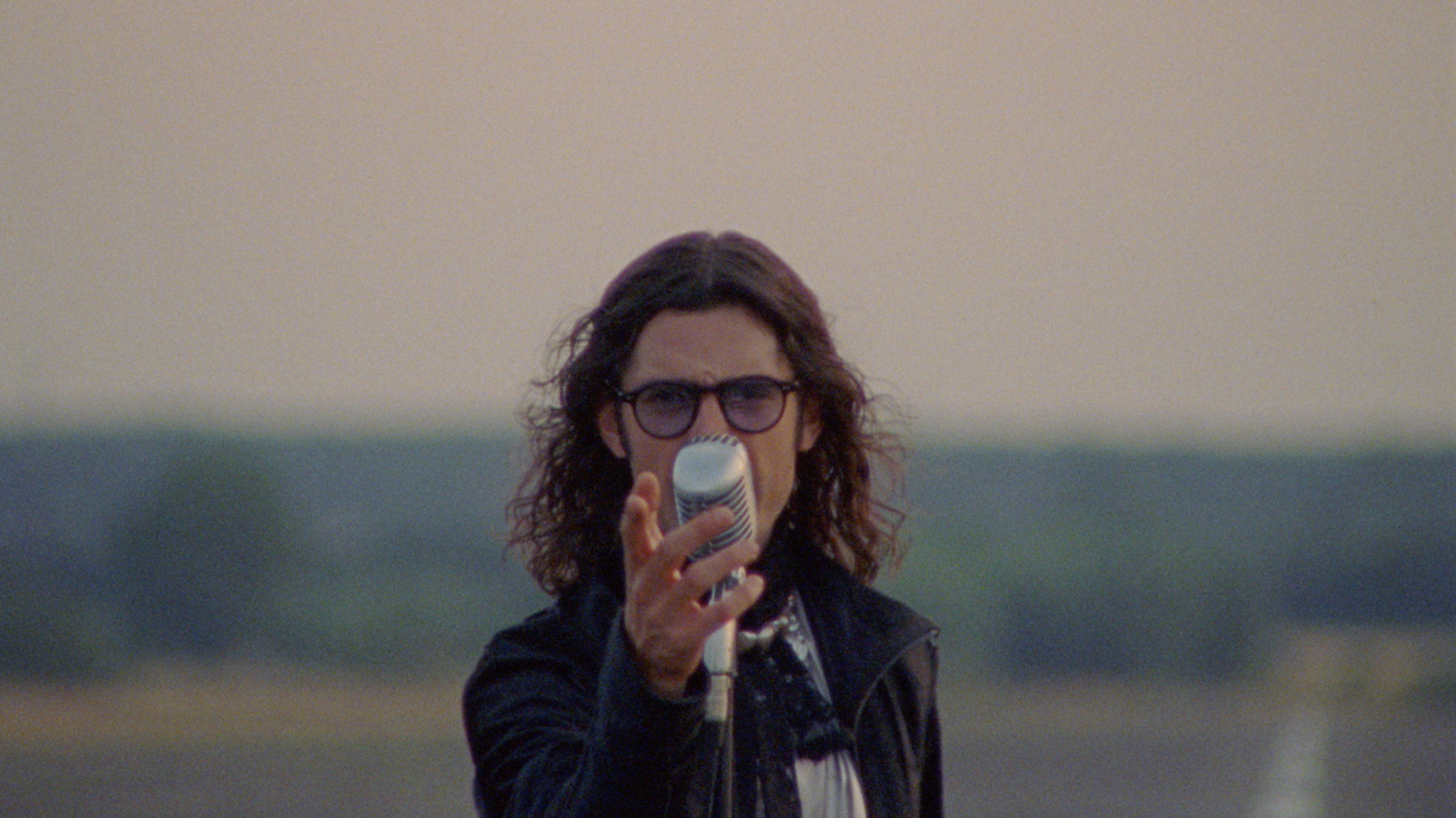 a man taking a picture with his cell phone