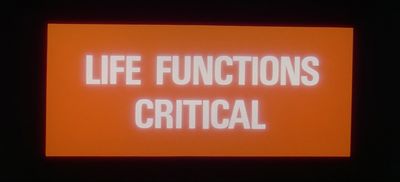 a neon sign that says life functions crittical