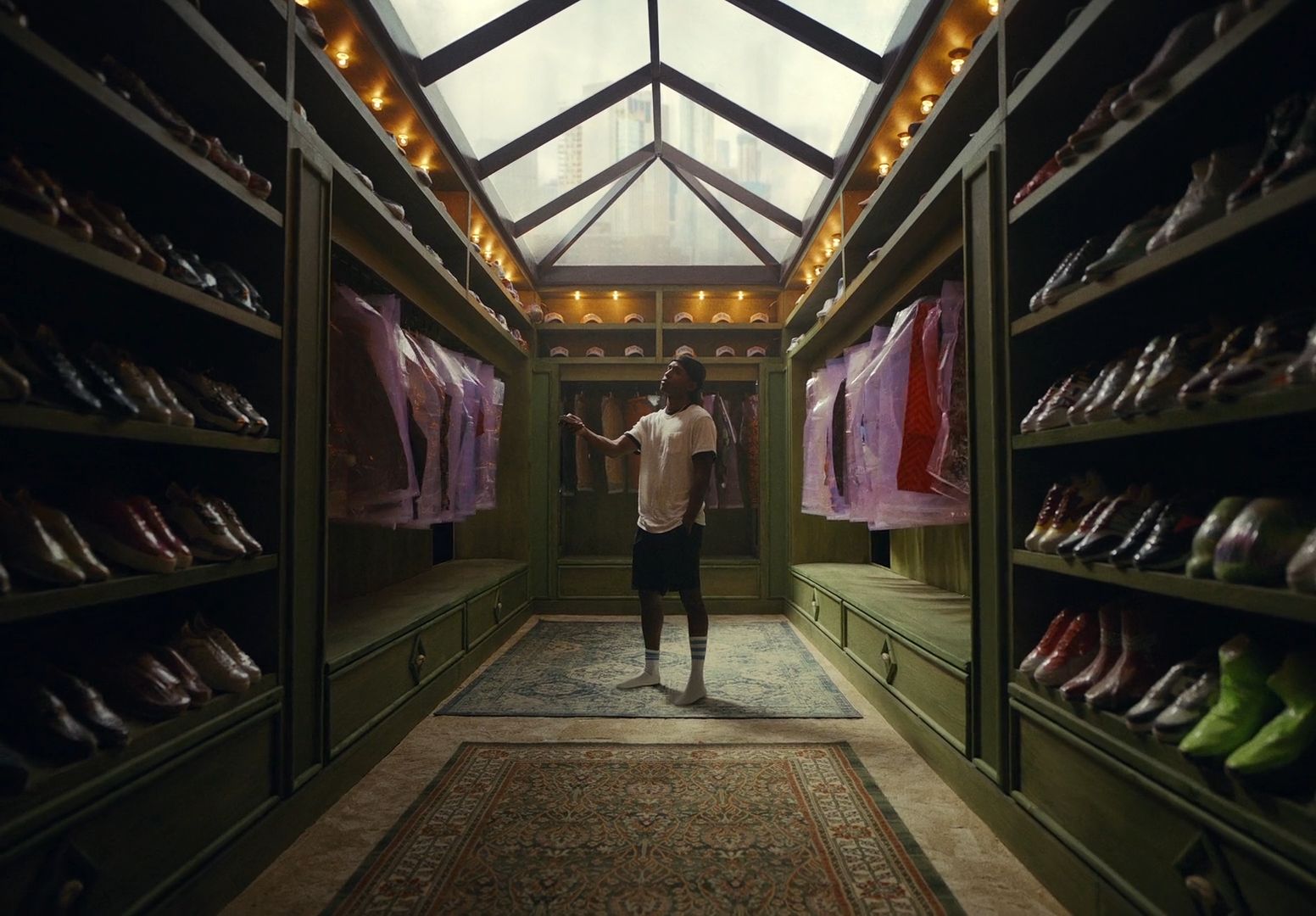 a man standing in a room with lots of shoes