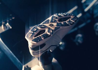 a close up of a pair of shoes on a stand