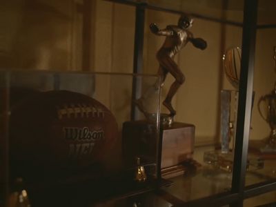 a trophy and a football on a shelf