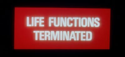 a red sign that says life functions terminated