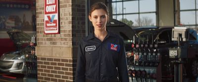 a woman standing in front of a building