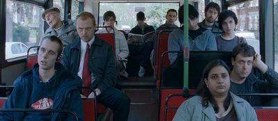 a group of people sitting on a bus