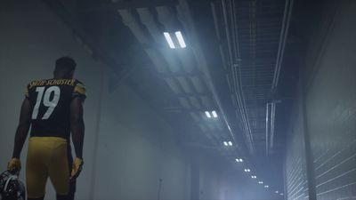 a football player is standing in a tunnel