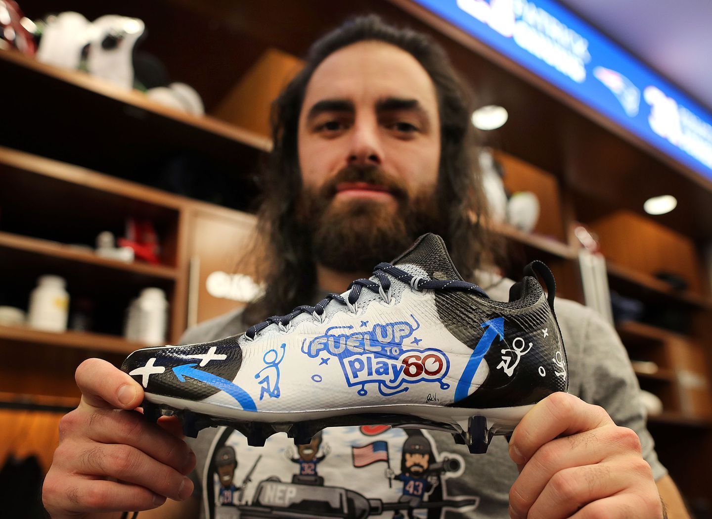 a man holding a shoe in his hands