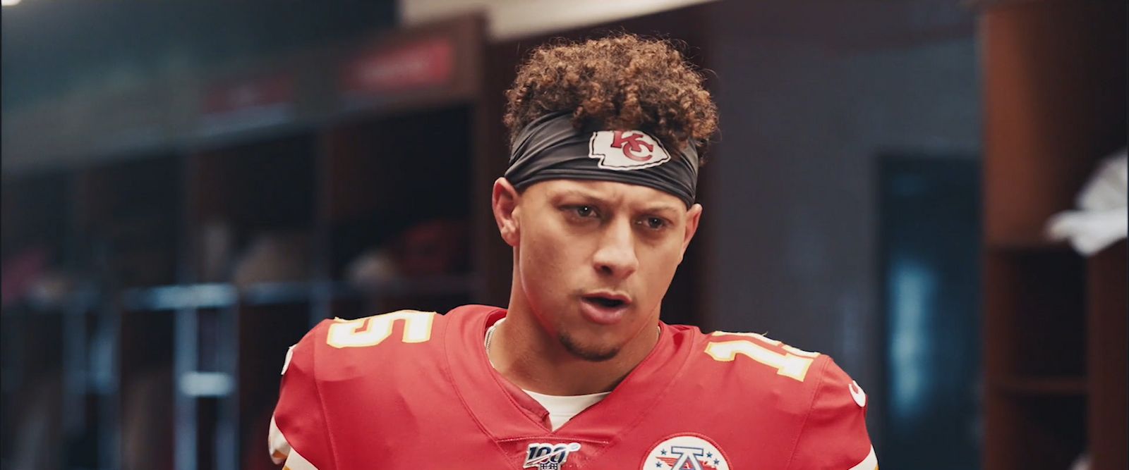 a close up of a football player wearing a bandana