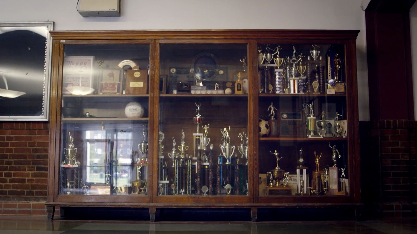 a display case filled with lots of trophies