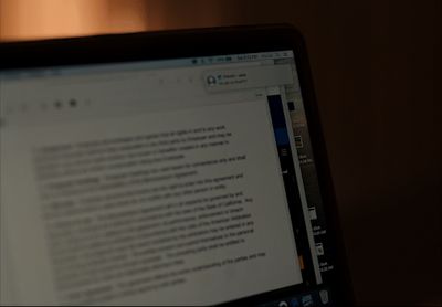 a laptop computer sitting on top of a desk