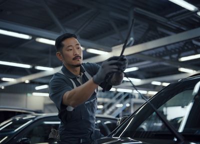 a man working on a car in a garage