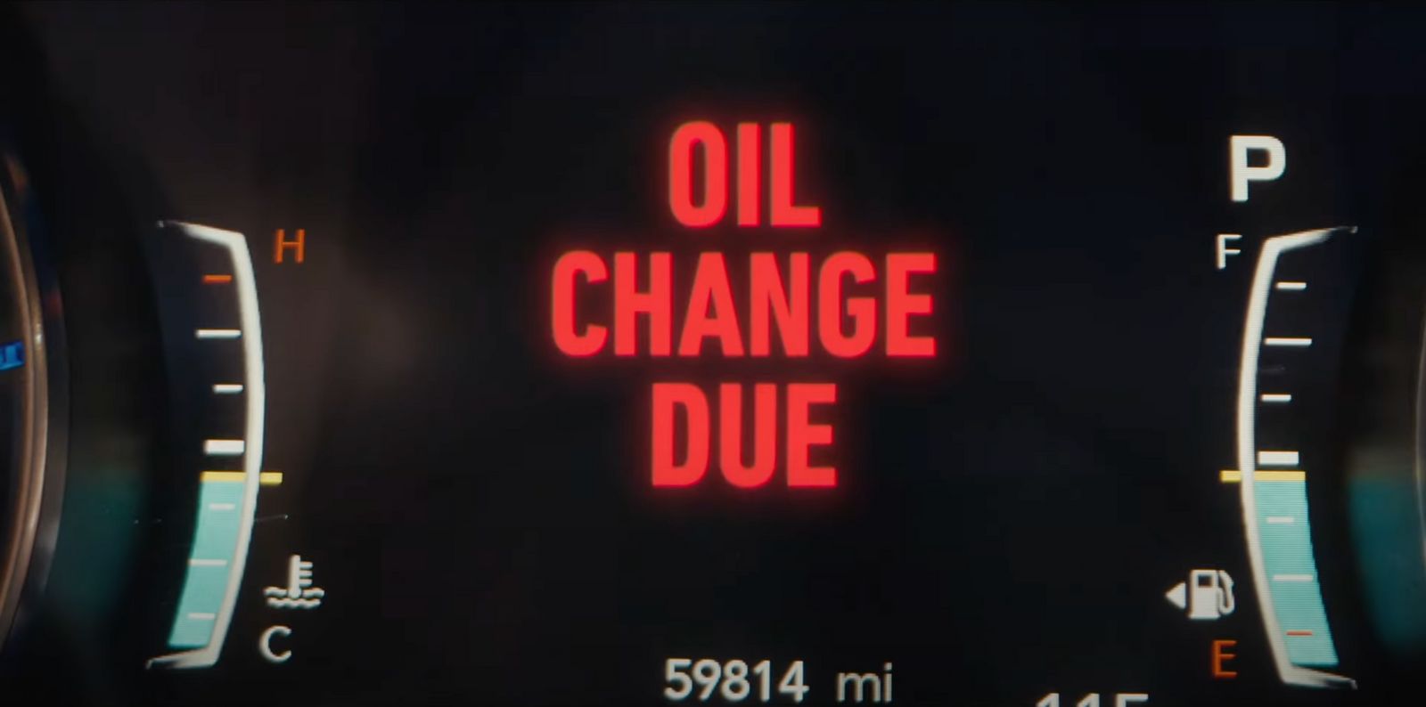 a close up of a speedometer with the words oil change due