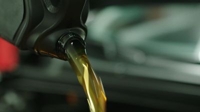 a close up of a gas pump being filled with oil