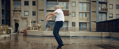 a man jumping in the air with a tennis racket