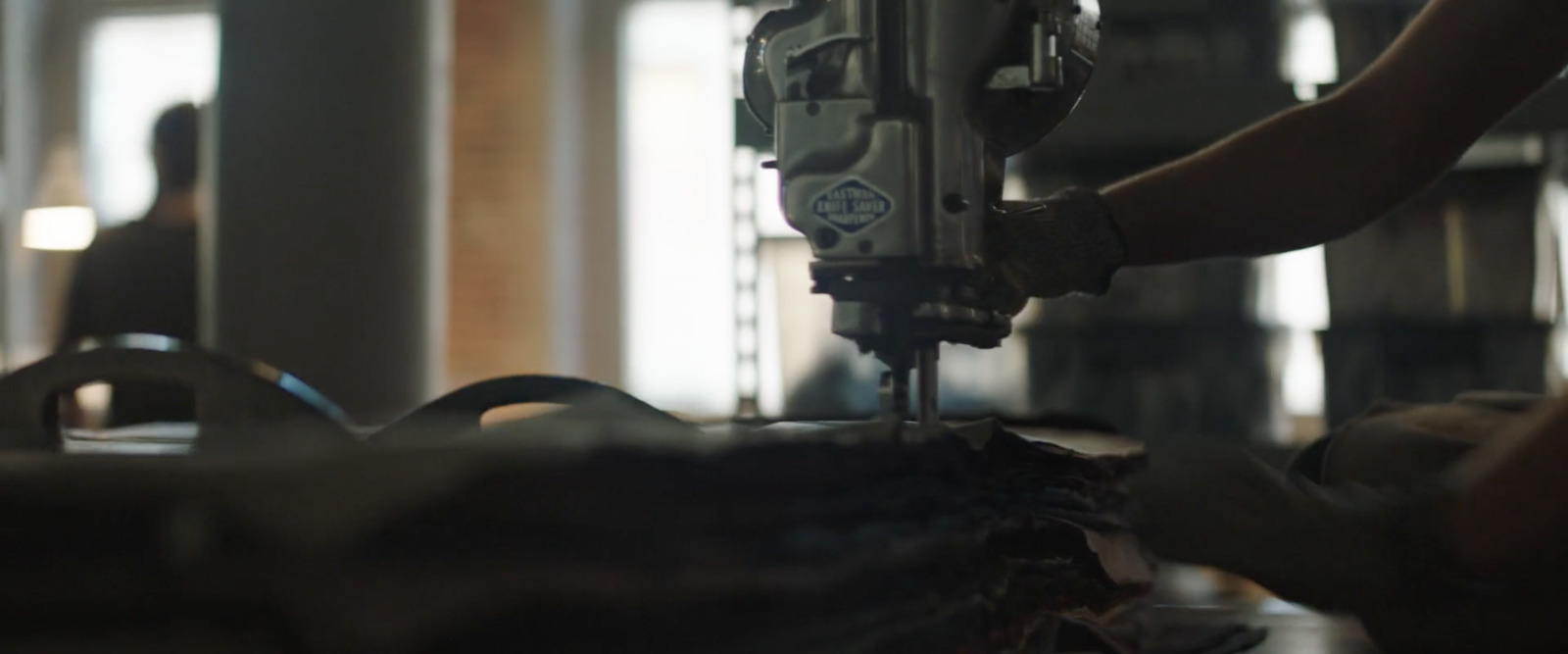 a person working on a machine in a factory