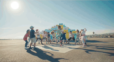 a group of people standing on top of an airport tarmac