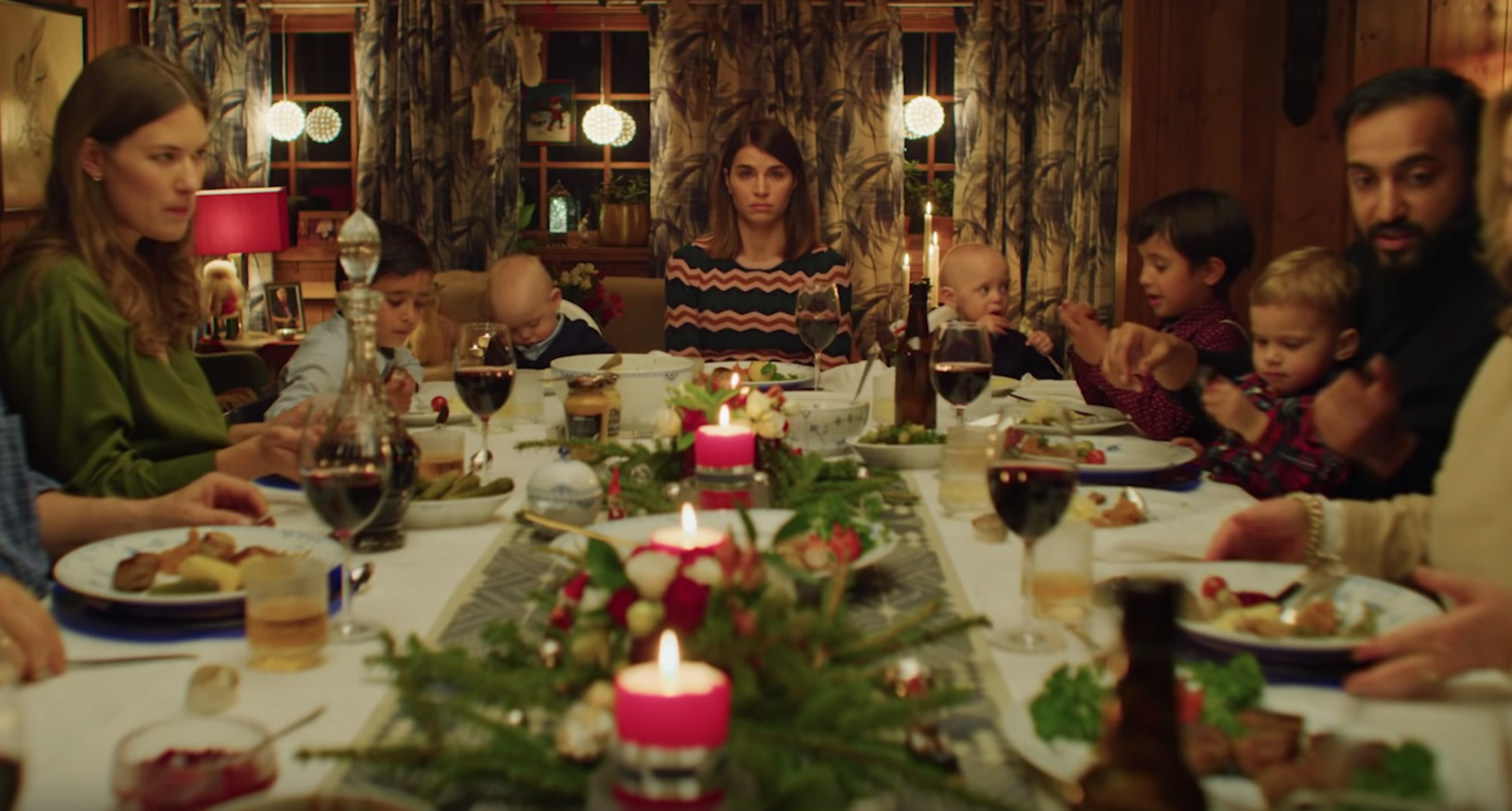 a group of people sitting around a dinner table