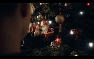 a christmas tree with ornaments and lights on it