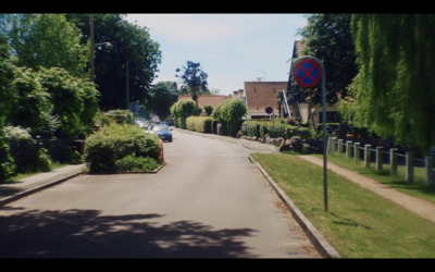 a street with cars parked on the side of it