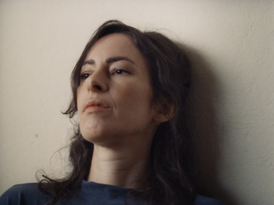 a woman with long hair is looking up