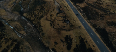 an aerial view of a road in the middle of nowhere