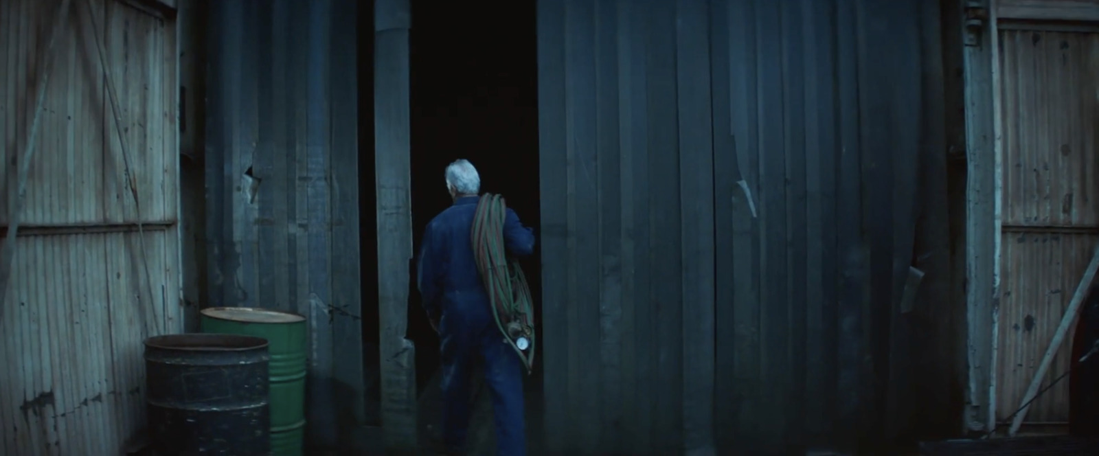 a man standing in a doorway of a building