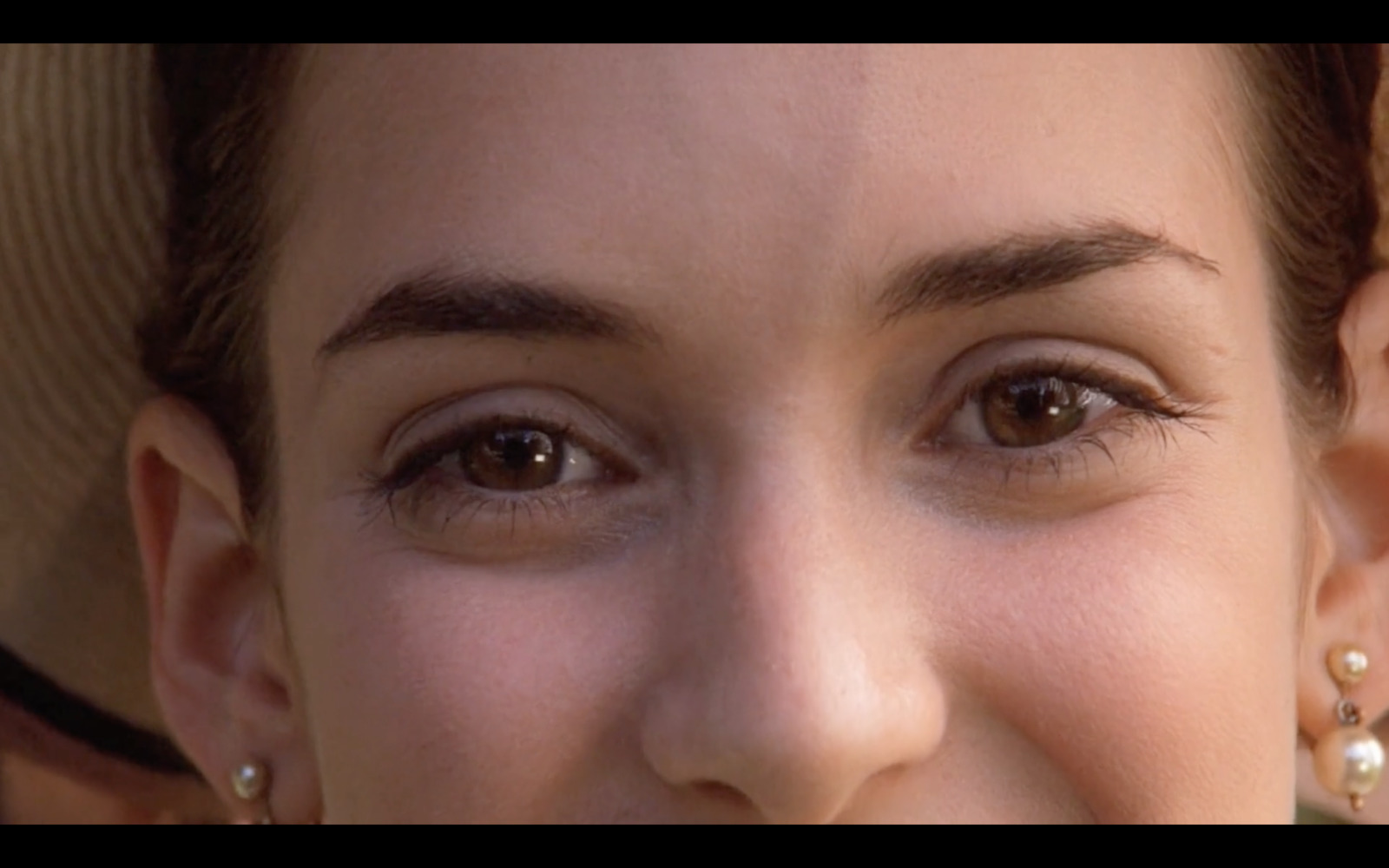 a close up of a person wearing a hat