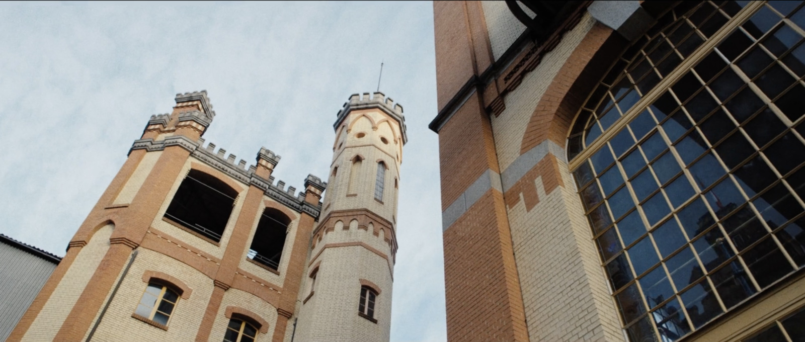 a tall building with a clock on the side of it