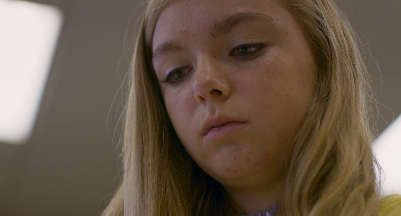 a close up of a person with long hair