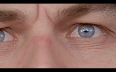 a close up of a person's blue eyes