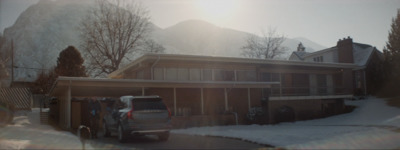 a truck is parked in front of a house