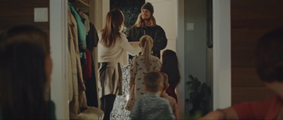 a group of people standing in front of a mirror