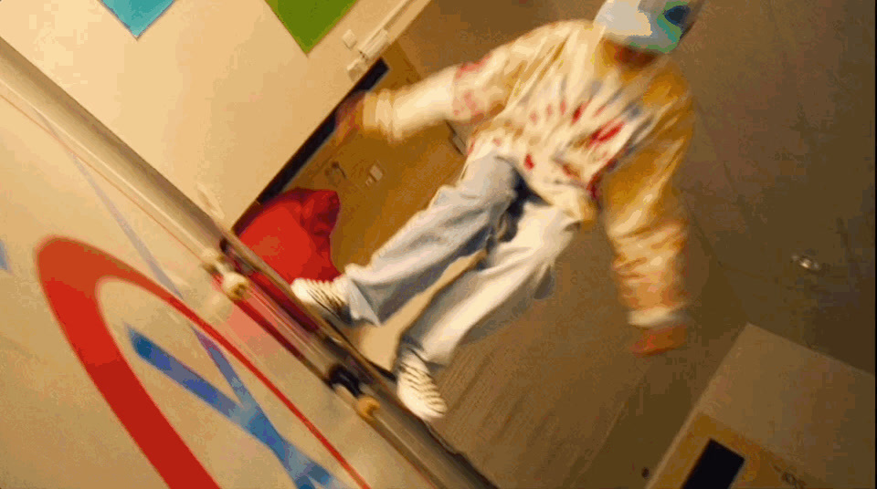 a man in a clown suit skateboarding on a ramp