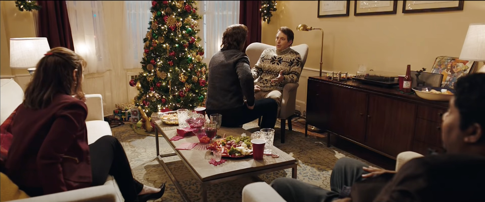 a group of people sitting around a living room