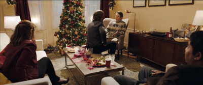 a group of people sitting around a living room