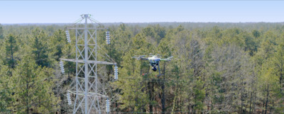 a man on a ski lift in the middle of a forest