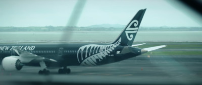 a large jetliner sitting on top of an airport tarmac