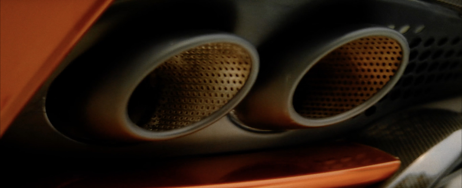 a close up of a pair of speakers on a car